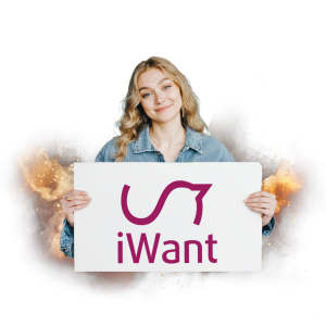 Žena drží ceduli s logem iWant na pozadí s ohnivými efekty.